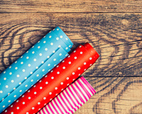 Sell gift wrap during the holidays as a successful booster club fundraising idea.