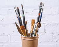 Transform your old sneakers into a masterpiece by painting them.