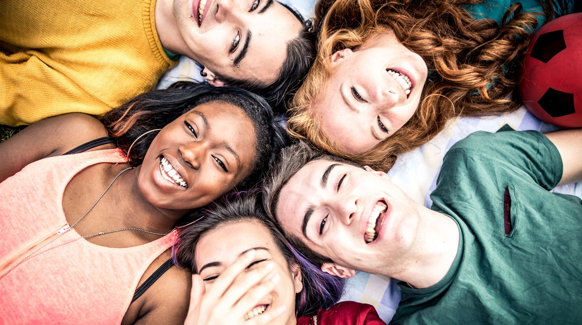Group of students celebrating with school parents.