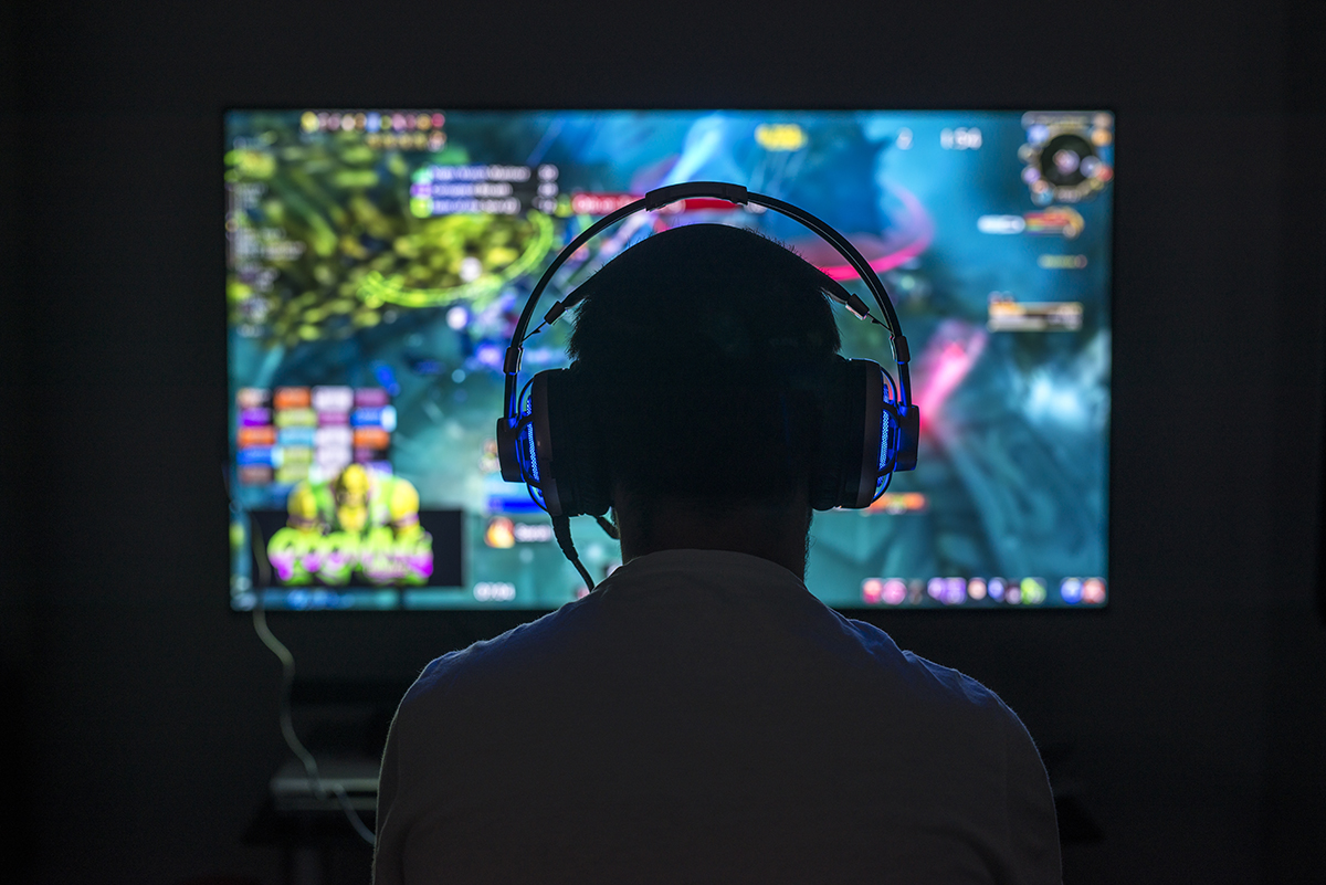 This is an image of someone playing a video game, representing the idea of how nonprofits can gamify giving to attract more donors.