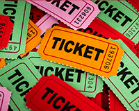 Raffle tickets on display for a fundraiser event, helping families raise adoption funds through community support.