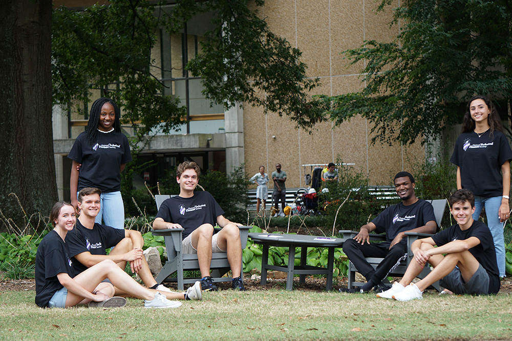 NTHS - kids sitting around an outdoor table