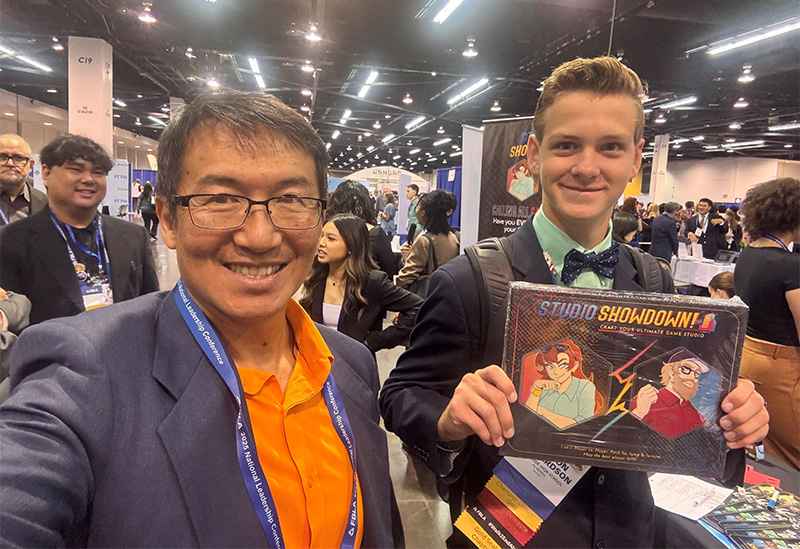 VGCD Academy student and instructor at a leadership conference, featured on the Funds2Orgs partnership page.