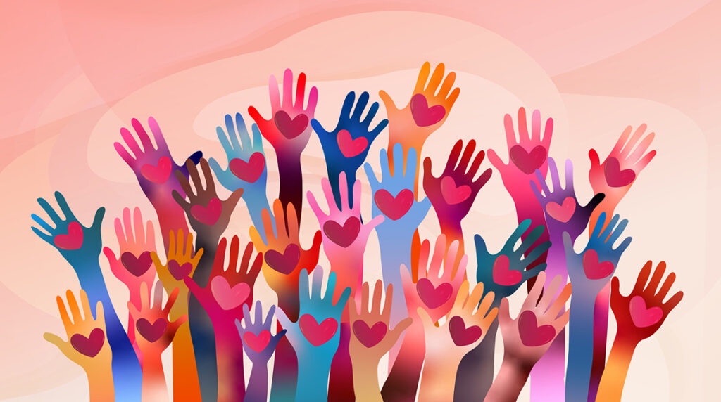 A group of colorful raised hands with hearts on their palms.