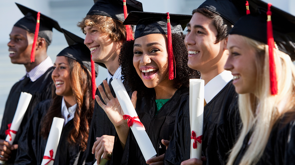 A group of graduating high school students excited about the future.