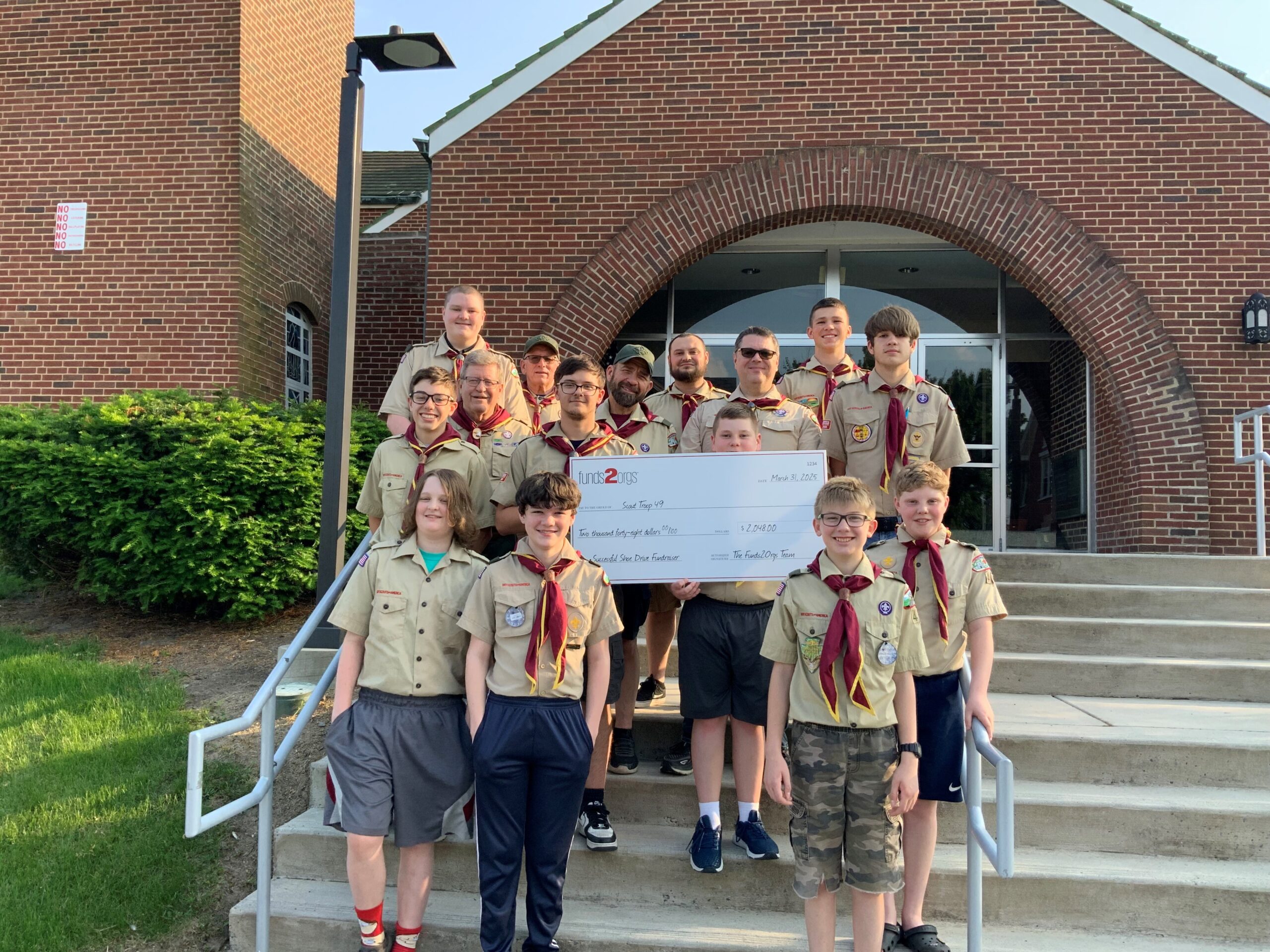 Group of Boy Scouts with check from Funds2Orgs.